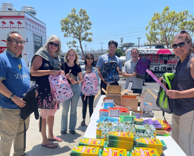 team of volunteers with hundreds of boxes of crayons for coloring