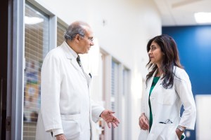 two doctors talking in the hallway